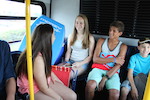 Teenagers riding bus
